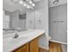 Bathroom featuring a large vanity, a large mirror, and overhead vanity lighting at 240 Springbottom Ct, Lawrenceville, GA 30046