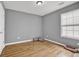 Bedroom featuring hardwood flooring, a large window, and space for relaxing or entertaining at 240 Springbottom Ct, Lawrenceville, GA 30046