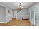 Bright dining room with a chandelier, sliding door access to a deck, and wood floors at 240 Springbottom Ct, Lawrenceville, GA 30046