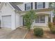 Close up of the home's front entrance and manicured landscaping that enhances curb appeal at 240 Springbottom Ct, Lawrenceville, GA 30046