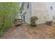 View of home's exterior with back porch, siding, landscaping, and mature trees at 240 Springbottom Ct, Lawrenceville, GA 30046