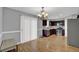 Modern kitchen featuring stainless steel appliances, wood cabinets, and an adjacent dining area at 240 Springbottom Ct, Lawrenceville, GA 30046