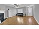 Inviting living room with fireplace, modern ceiling fan, and durable wood flooring at 240 Springbottom Ct, Lawrenceville, GA 30046