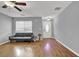 Inviting living room with fireplace, modern ceiling fan, and durable wood flooring at 240 Springbottom Ct, Lawrenceville, GA 30046