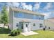 The back exterior features gray siding, a patio and an enclosed back door area at 2590 Carolina Rdg, Riverdale, GA 30296