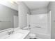 Clean bathroom featuring a tub/shower combo, white vanity, and a large mirror above the sink at 2590 Carolina Rdg, Riverdale, GA 30296