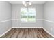 Bright dining room illuminated by natural light streaming through the large window at 2590 Carolina Rdg, Riverdale, GA 30296