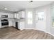 Modern kitchen with stainless steel appliances and an adjoining back door at 2590 Carolina Rdg, Riverdale, GA 30296