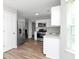 Modern kitchen features stainless steel appliances and ample cabinet space at 2590 Carolina Rdg, Riverdale, GA 30296