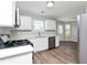 Well-equipped kitchen featuring stainless steel appliances, ample counter space, and modern cabinetry at 2590 Carolina Rdg, Riverdale, GA 30296