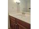 Bathroom vanity features a white countertop, wood cabinets, and a classic faucet at 2929 Torreya Se Way, Marietta, GA 30067