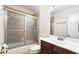 Well-maintained bathroom with a sliding shower door and updated vanity at 2929 Torreya Se Way, Marietta, GA 30067