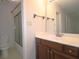 Bathroom featuring a shower-tub combo and a vanity with ample counter space at 2929 Torreya Se Way, Marietta, GA 30067