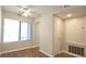 Well-lit bedroom featuring a ceiling fan, closet, and large window at 2929 Torreya Se Way, Marietta, GA 30067