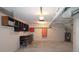 Spacious garage area with shelving and cabinets, painted in neutral tones, offers ample storage at 2929 Torreya Se Way, Marietta, GA 30067