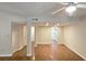 Living room featuring open floor plan to dining area, hardwood floors, and neutral paint scheme at 2929 Torreya Se Way, Marietta, GA 30067