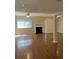 Bright living room featuring hardwood floors, a cozy fireplace, and abundant natural light at 2929 Torreya Se Way, Marietta, GA 30067
