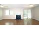 Sunlit living room with hardwood floors, fireplace, ceiling fans, and sliding glass door to yard at 2929 Torreya Se Way, Marietta, GA 30067