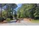 Street view of property with mature trees and lush landscaping at 2929 Torreya Se Way, Marietta, GA 30067