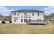 Large backyard with a deck, lawn, and view of the home's rear exterior at 5658 Greensage Dr, Atlanta, GA 30349