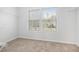 Walk in closet featuring carpet floors, and window with natural light at 5658 Greensage Dr, Atlanta, GA 30349