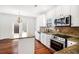Updated kitchen featuring stainless steel appliances, granite countertops, tile backsplash, and center island at 5658 Greensage Dr, Atlanta, GA 30349