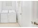 Well-lit laundry room with washer and dryer hookups and storage at 5658 Greensage Dr, Atlanta, GA 30349