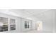 Spacious living room with large windows and decorative wall mirrors at 5658 Greensage Dr, Atlanta, GA 30349