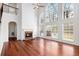 Spacious living room with hardwood floors, fireplace, high ceilings and lots of natural light at 5658 Greensage Dr, Atlanta, GA 30349