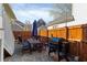 Backyard featuring a grill, a table, and a wooden privacy fence with string lights at 93 Hammock Se Pl, Atlanta, GA 30312