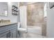 Bathroom featuring a shower-tub combo with granite counters and decor at 93 Hammock Se Pl, Atlanta, GA 30312