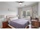Bedroom featuring a ceiling fan, large window, desk, and hardwood floors at 93 Hammock Se Pl, Atlanta, GA 30312