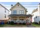 Charming two-story home featuring a covered front porch and a well-maintained yard at 93 Hammock Se Pl, Atlanta, GA 30312