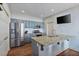 Kitchen with gray cabinets, granite countertops, stainless appliances and a breakfast bar at 93 Hammock Se Pl, Atlanta, GA 30312
