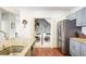 Kitchen with stainless steel refrigerator and a laundry closet with washer and dryer at 93 Hammock Se Pl, Atlanta, GA 30312