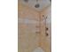 Shower with tan tile, dual shower heads, and built in baskets at 93 Hammock Se Pl, Atlanta, GA 30312