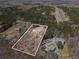 Aerial view of a vast property surrounded by a dense forest at 9640 Cedar Grove Rd, Fairburn, GA 30213