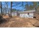 Spacious backyard with mature trees and a home with white siding at 9640 Cedar Grove Rd, Fairburn, GA 30213