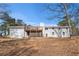 Rear exterior of home with wooden deck at 9640 Cedar Grove Rd, Fairburn, GA 30213