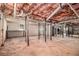 Unfinished basement with exposed ductwork and support beams, awaiting customization and build-out potential at 9640 Cedar Grove Rd, Fairburn, GA 30213