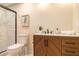 Bathroom features a stylish vanity with marble countertop, walk-in shower with glass door, and modern fixtures at 9640 Cedar Grove Rd, Fairburn, GA 30213