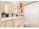Bright bathroom with a modern vanity, quartz countertop, and shower with a white shower curtain at 9640 Cedar Grove Rd, Fairburn, GA 30213