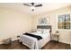 Simple bedroom design with window view, soft carpet, and a comfortable bed at 9640 Cedar Grove Rd, Fairburn, GA 30213