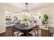 Elegant dining room adjacent to the modern kitchen and cozy living space at 9640 Cedar Grove Rd, Fairburn, GA 30213