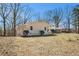Ranch-style home with well-maintained lawn and mature trees at 9640 Cedar Grove Rd, Fairburn, GA 30213