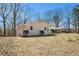 Charming single-story home with white siding, well-maintained landscaping, and mature trees at 9640 Cedar Grove Rd, Fairburn, GA 30213