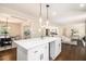 Bright kitchen featuring a large island, stainless steel appliances, hardwood floors and open concept living at 9640 Cedar Grove Rd, Fairburn, GA 30213