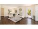 Cozy living room with a brick fireplace, hardwood floors, and an outdoor view at 9640 Cedar Grove Rd, Fairburn, GA 30213