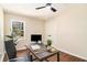 Cozy office space with natural light, a ceiling fan, and ample workspace at 9640 Cedar Grove Rd, Fairburn, GA 30213