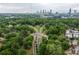 Wide aerial shot of lush green trees with the city skyline in the background at 966 Blue Ridge Ne Ave, Atlanta, GA 30306